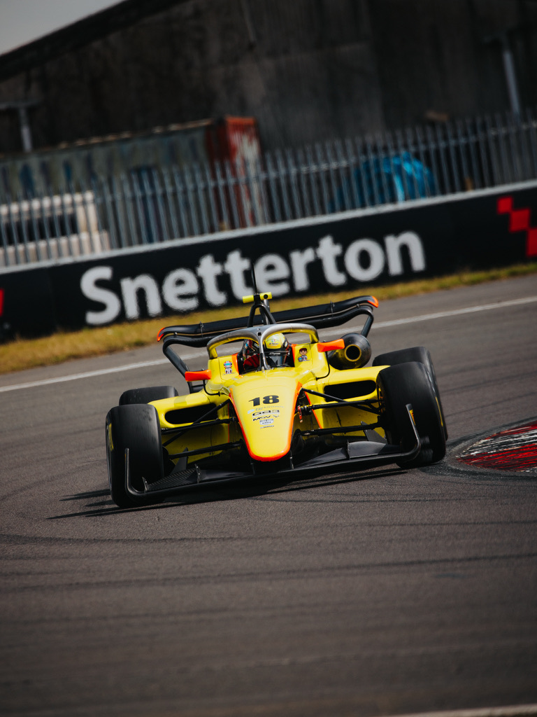 Emmilio with Venezuelan flag Oulton Park podium